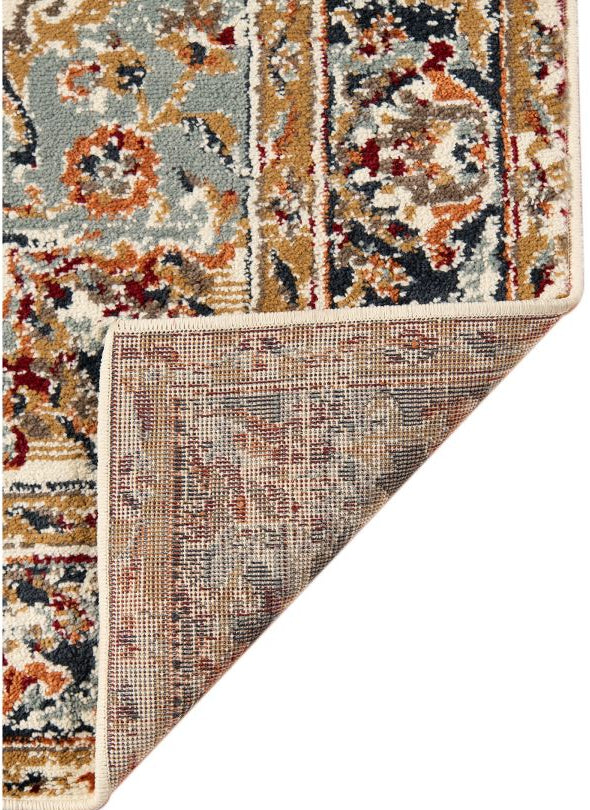 Patterned rug corner with multicolor design on a white background