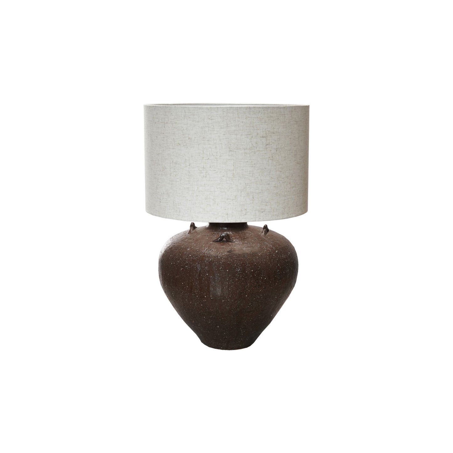 Table lamp with a textured brown base and a light gray shade on a white background