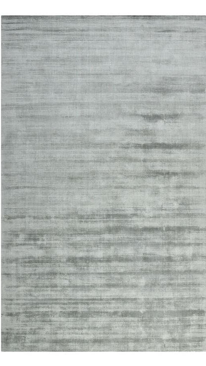 Gray area rug with a subtle pattern on a white background