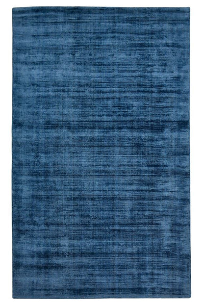 Blue textured rug on a white background