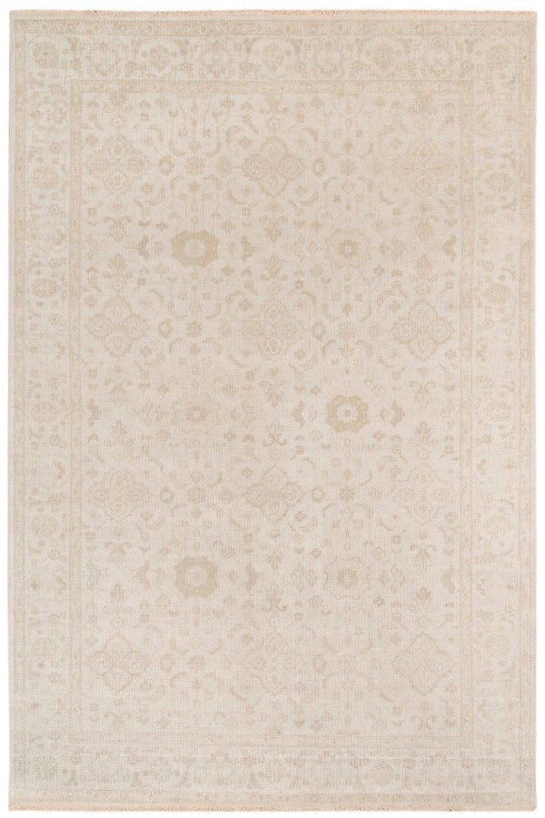 Beige area rug with subtle pattern on a white background