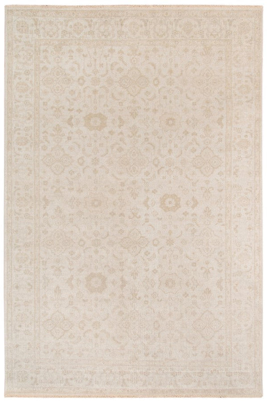 Beige area rug with subtle pattern on a white background