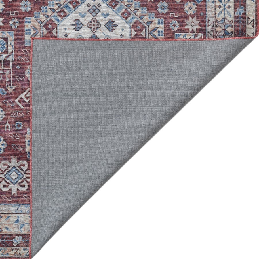 Gray rug with a patterned border on a white background