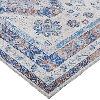 Close-up of a patterned rug with blue and brown colors on a white background