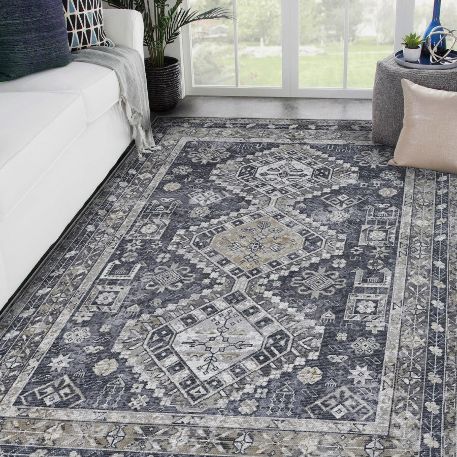 Patterned area rug in a living room setting with furniture and decor.
