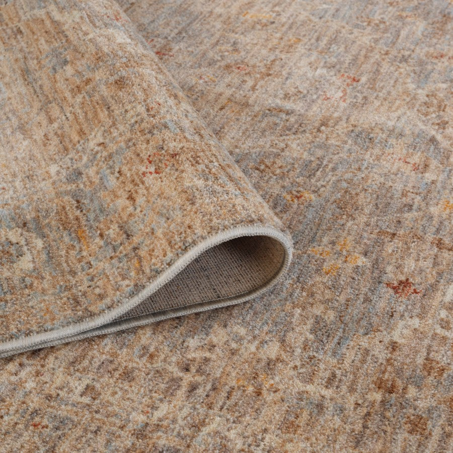 Close-up of a textured beige and brown rug with a slight pattern.
