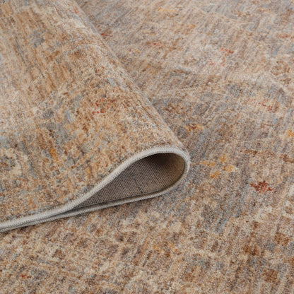 Close-up of a textured beige and brown rug with a slight pattern.