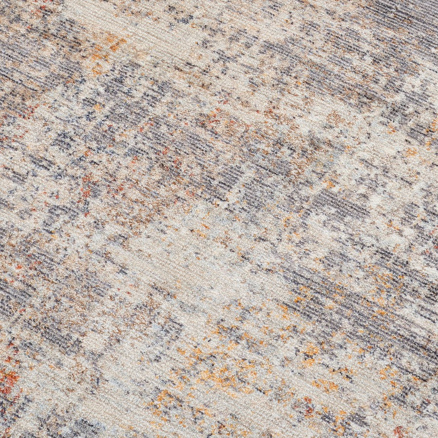 Close-up of a textured stone surface with beige, brown, and gray colors.