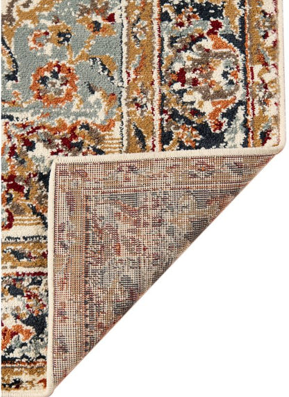 Patterned rug corner with multicolor design on a white background