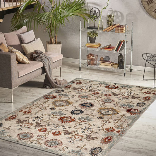 Living room with a floral patterned rug, sofa, and decorative shelves.