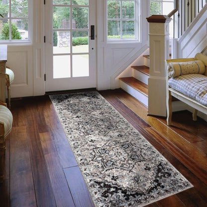 Long, patterned rug on a wooden floor in a home interior.
