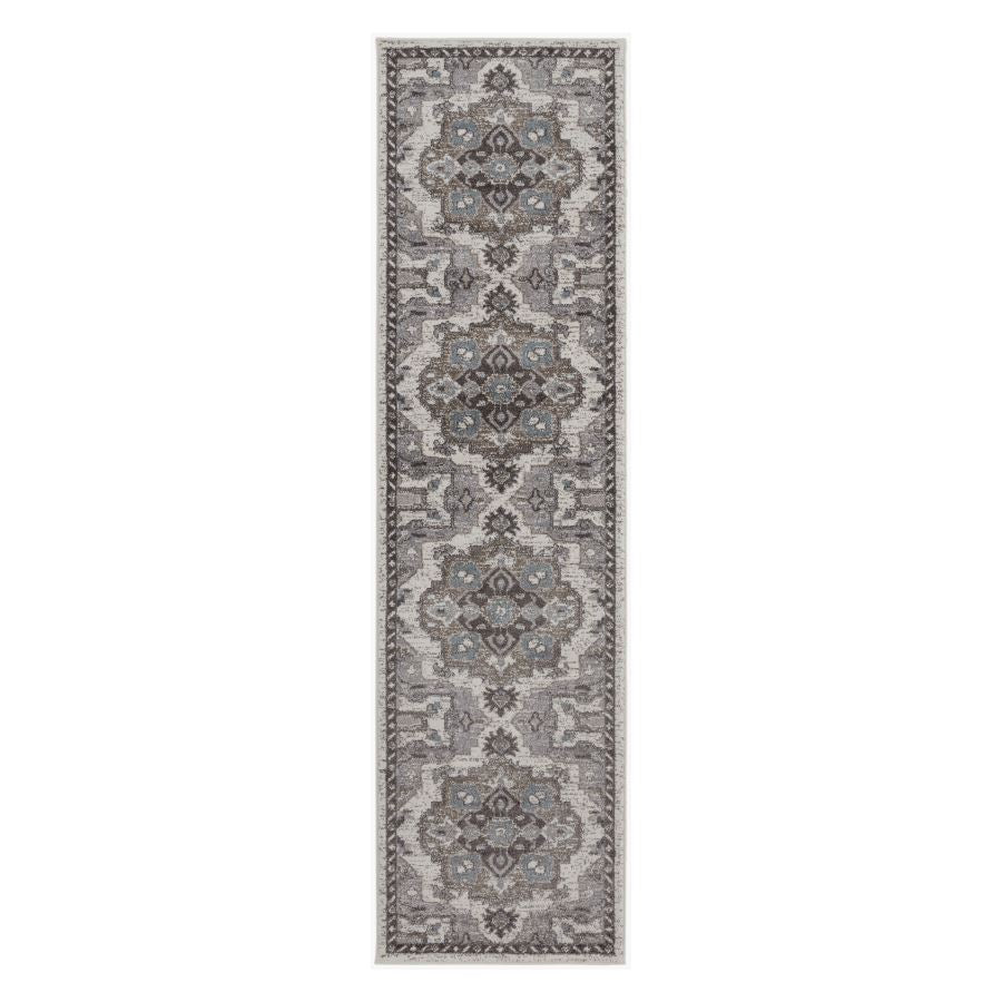 Long rectangular gray area rug with intricate patterns on a white background
