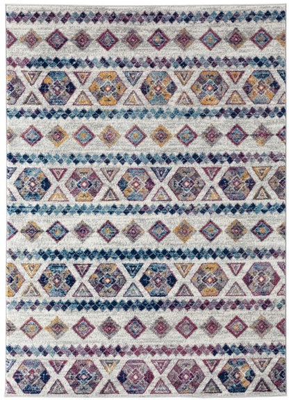 Multicolored geometric patterned rug on a white background