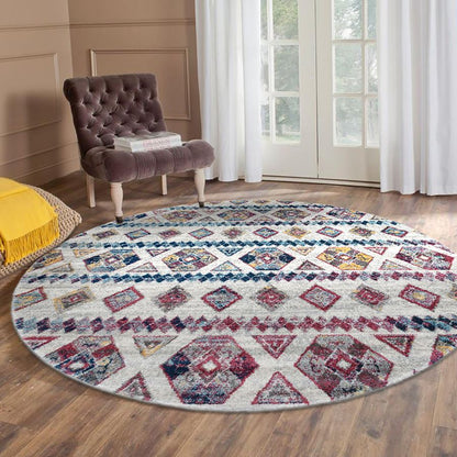 Round patterned rug on a wooden floor with a chair and yellow pillow in the background.