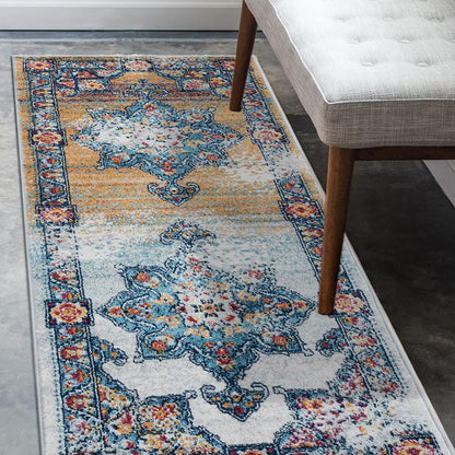 Decorative rug with intricate patterns on a floor next to a chair.