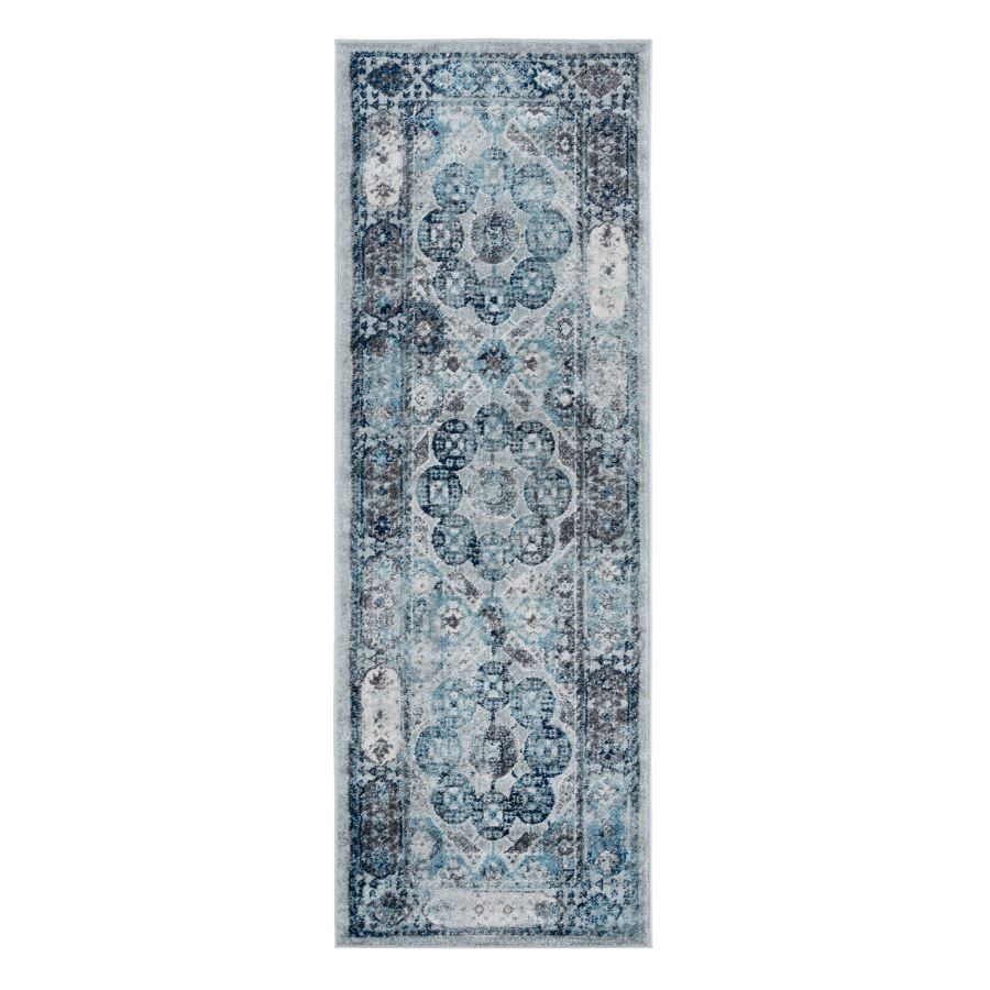 Patterned blue and white rug on a white background