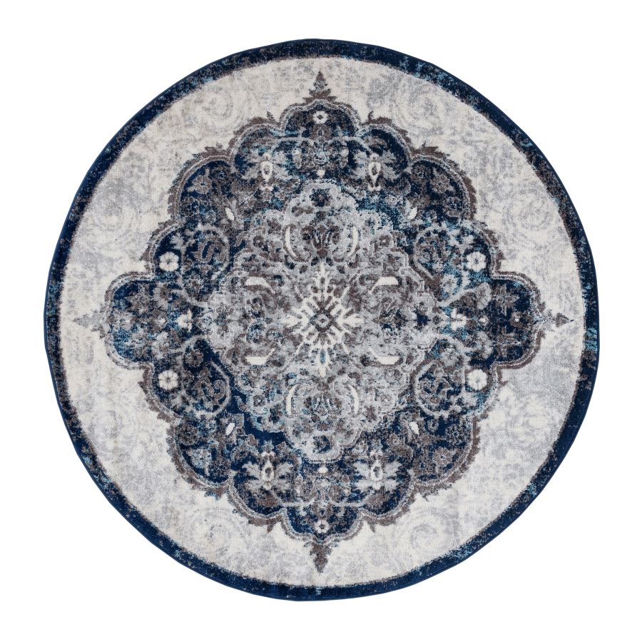 Round rug with intricate blue and gray pattern on a white background