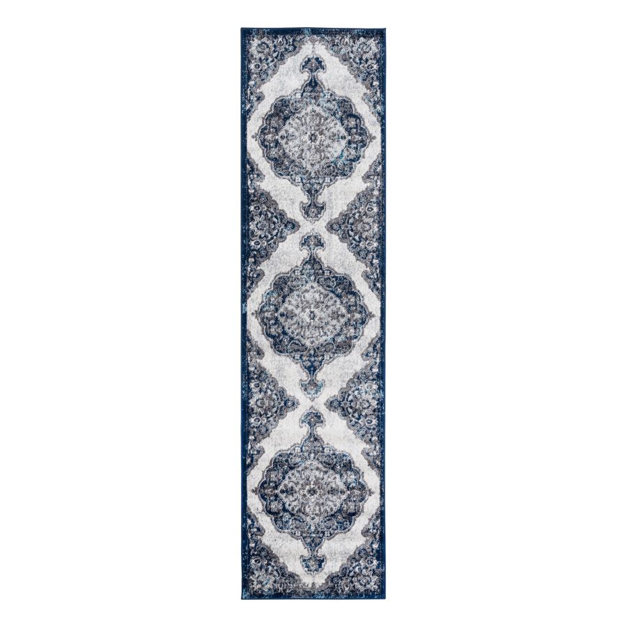 Navy blue and white patterned runner rug on a white background