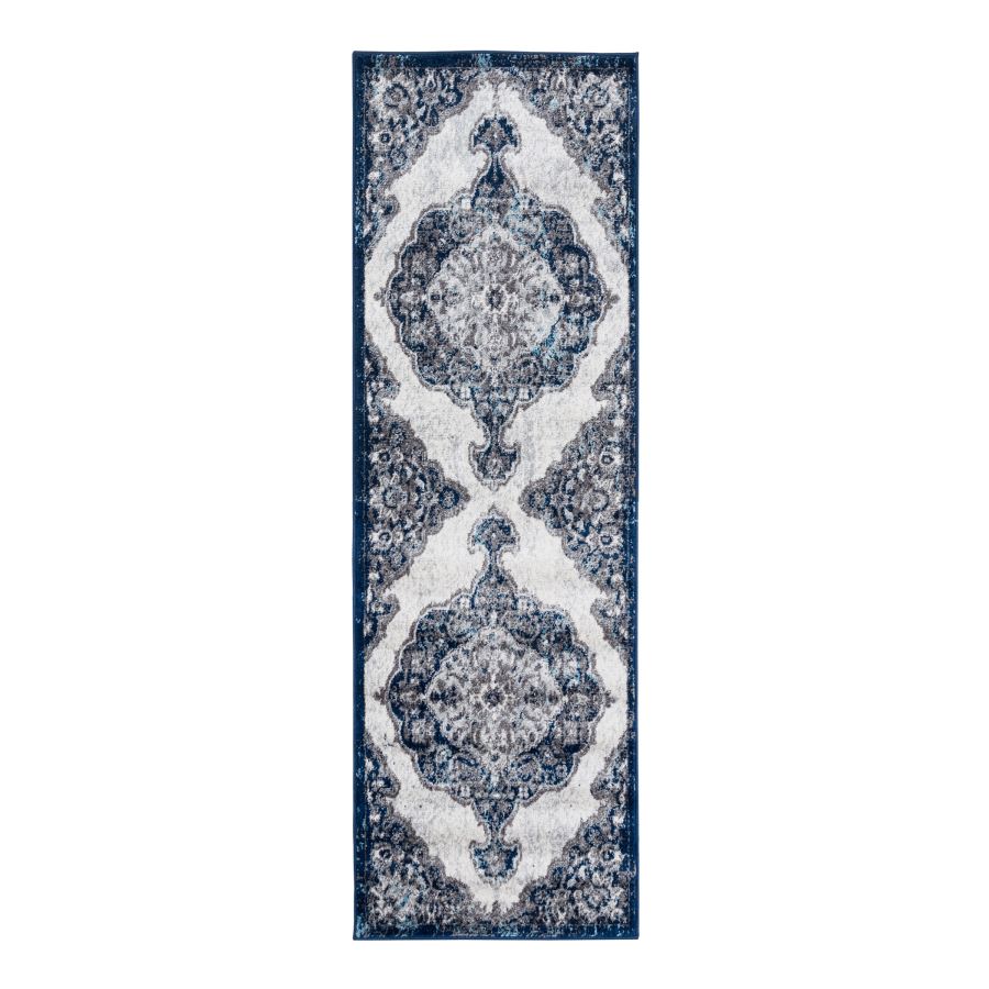 Navy blue and white patterned runner rug on a white background