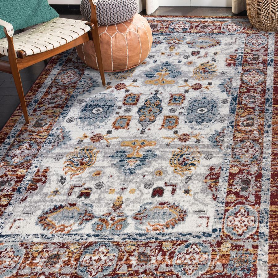 Patterned area rug in a room with furniture