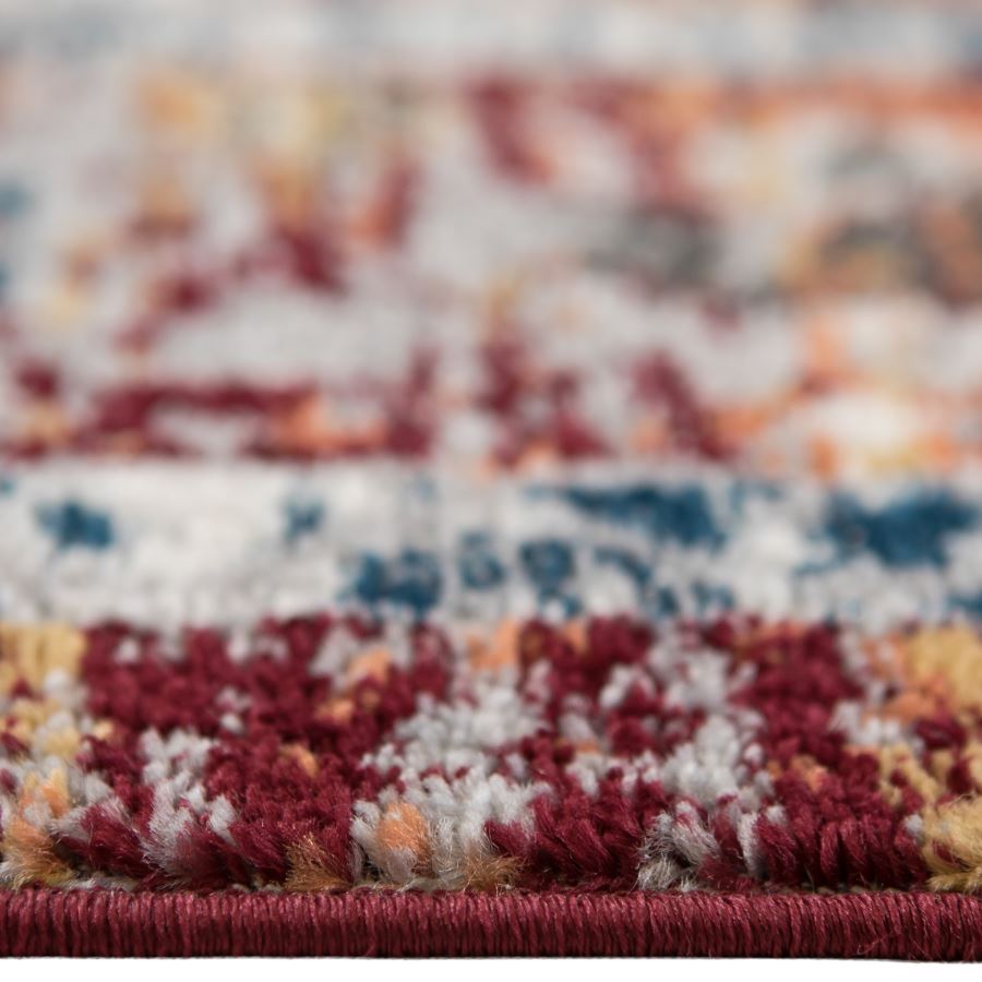 Close-up of a multicolored textured rug with a blurred background