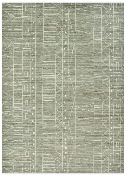 Green and white geometric patterned rug on a white background