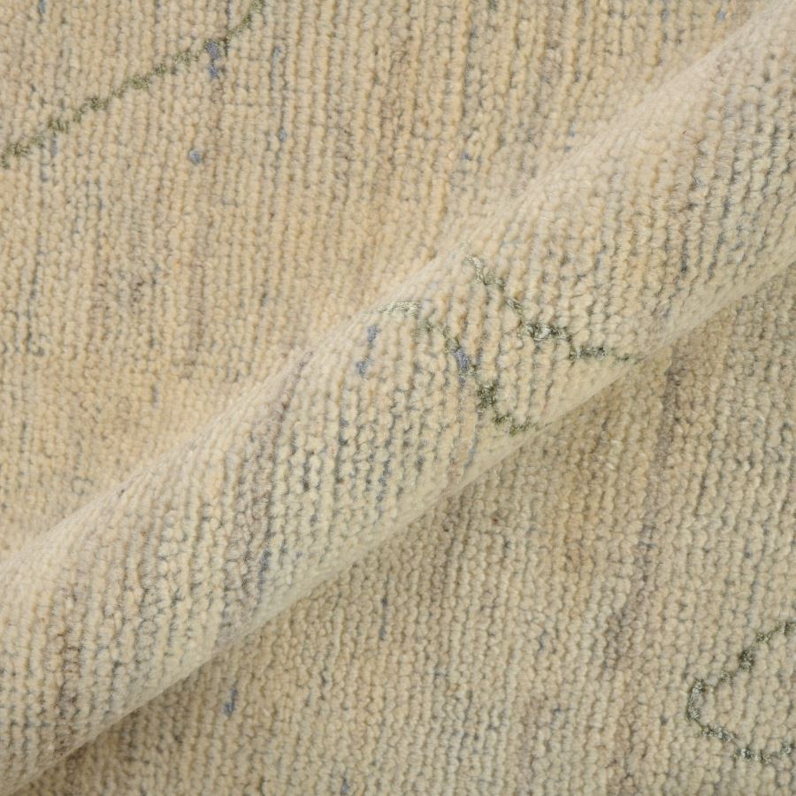 Close-up of textured beige fabric with subtle patterns