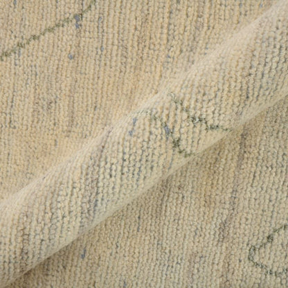 Close-up of textured beige fabric with subtle patterns