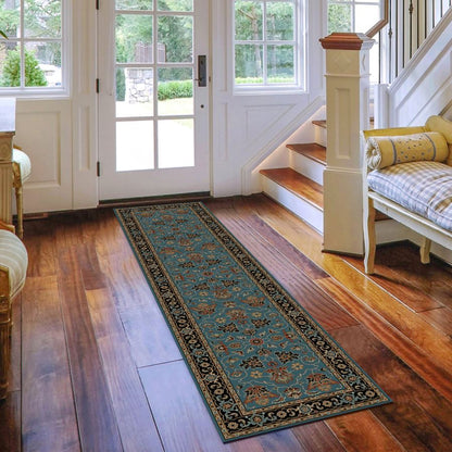 Decorative rug on a wooden floor in a home setting with a staircase and doors.