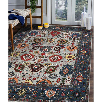 Decorative rug with floral patterns on a wooden floor.