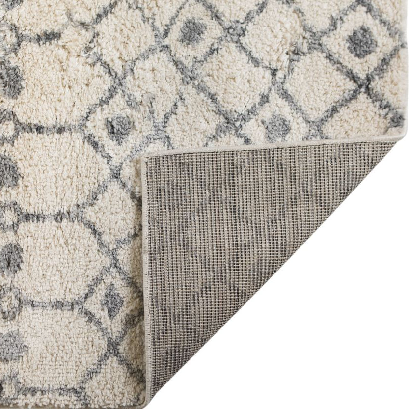 Close-up of a textured rug with geometric pattern on a white background