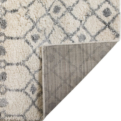 Close-up of a textured rug with geometric pattern on a white background