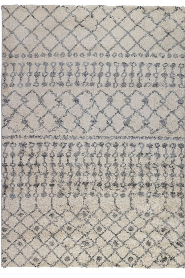 Patterned rug with geometric design on a white background
