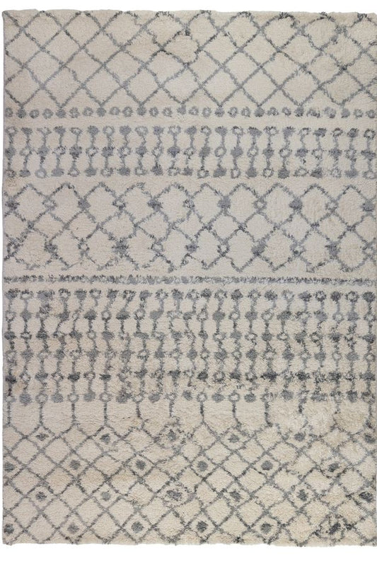 Patterned rug with geometric design on a white background