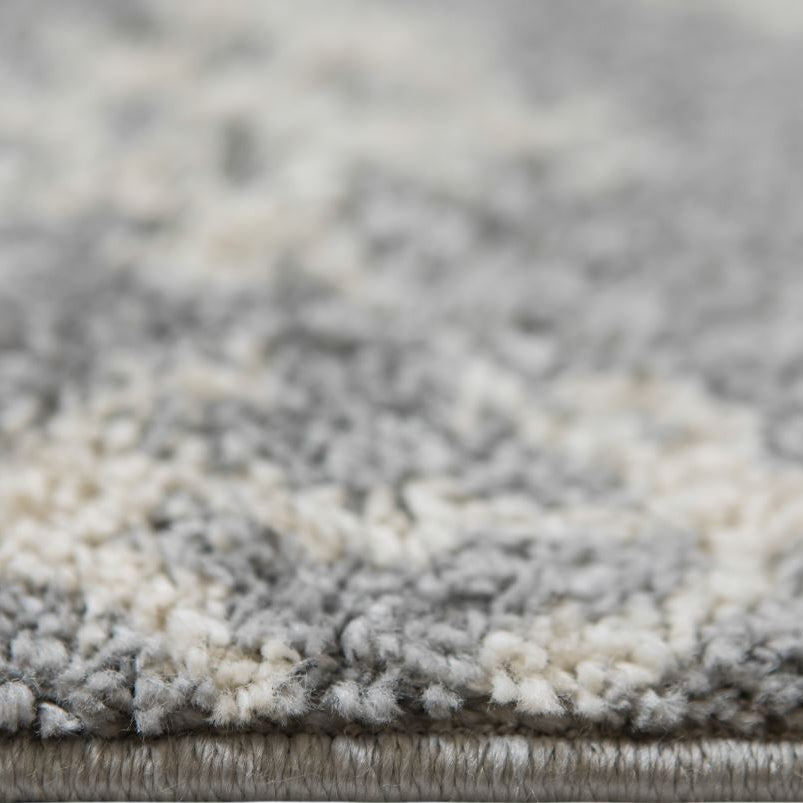 Close-up of a textured gray and white rug
