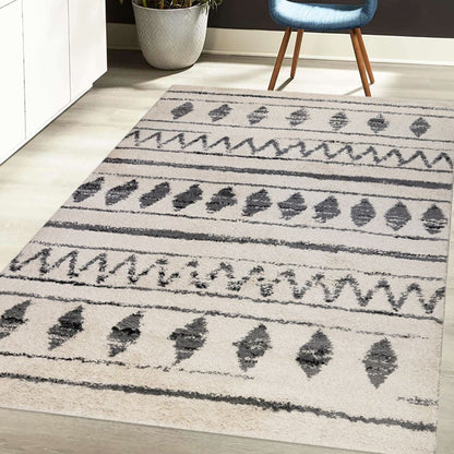 Patterned rug on a wooden floor with a chair and plant in the background