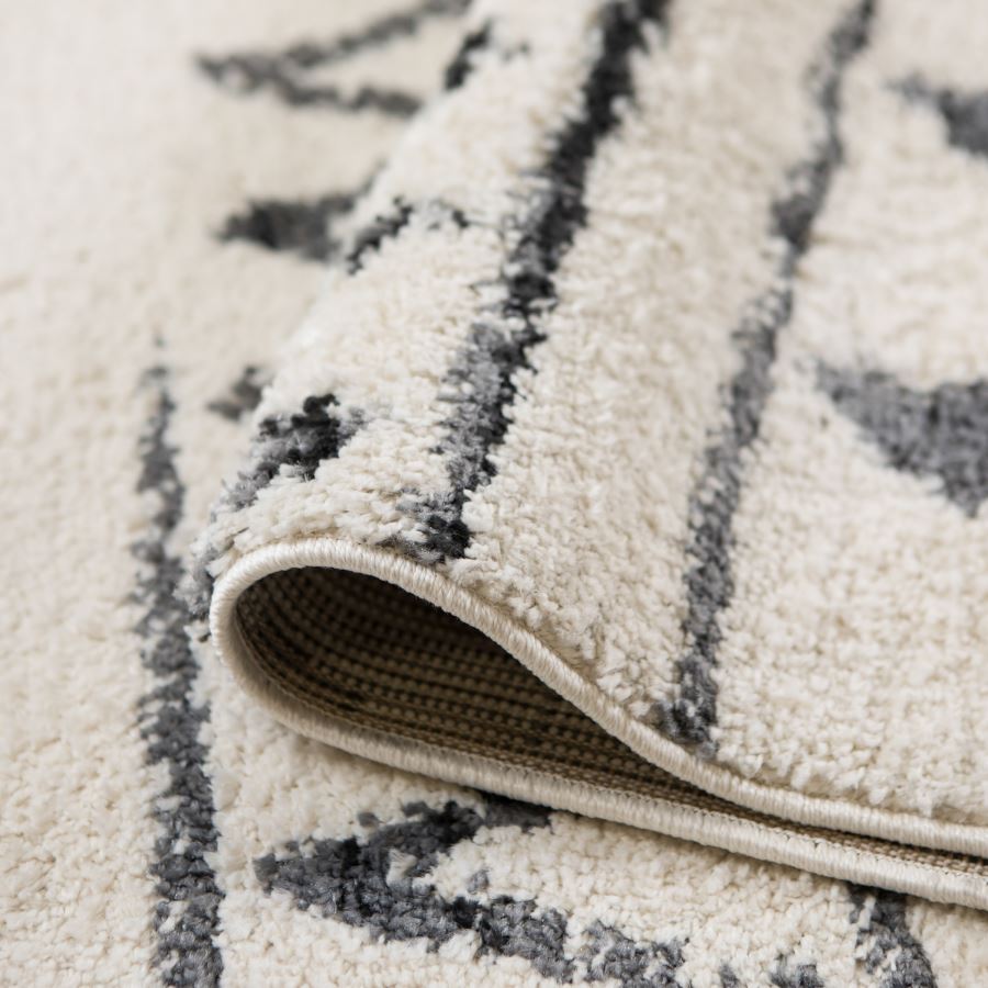 Close-up of a textured rug with geometric pattern