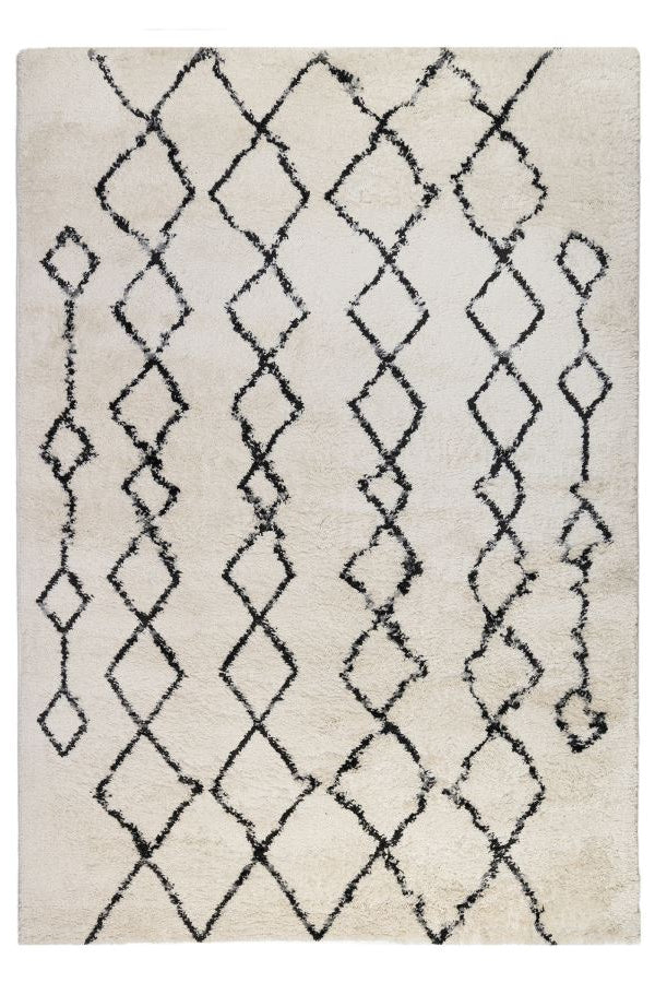 Beige rug with black geometric pattern on a white background