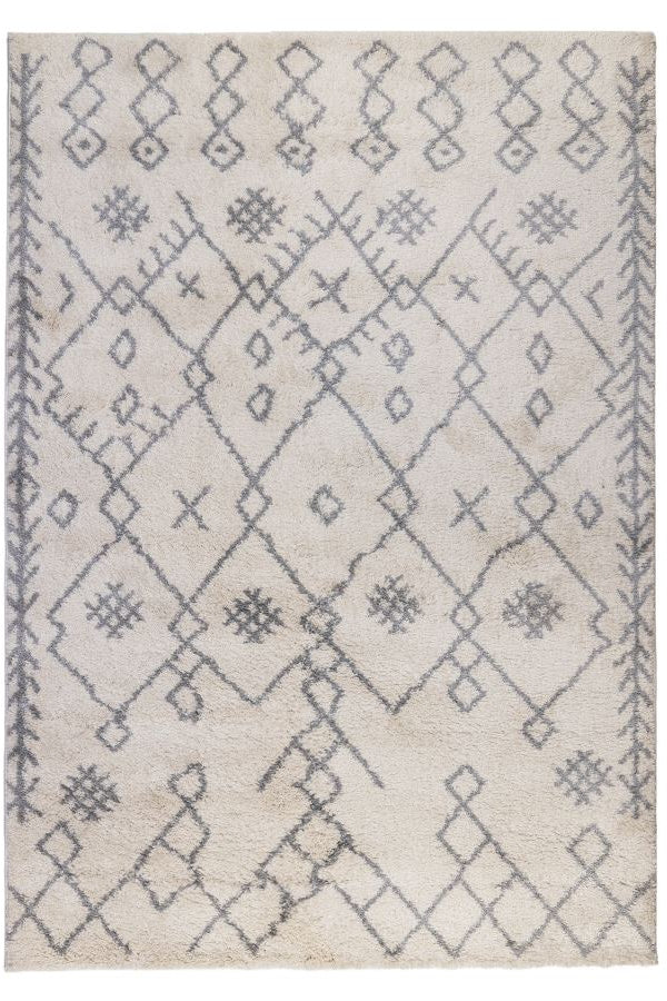 Beige rug with geometric pattern on a white background