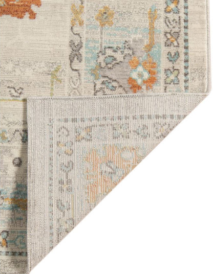 Close-up of a floral patterned rug with a neutral color palette.
