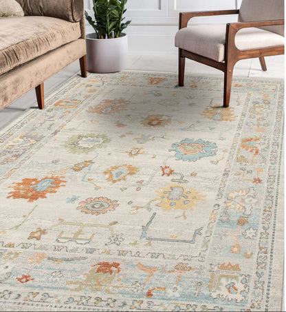 Patterned rug in a living room with furniture and decor.