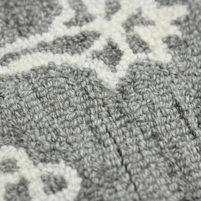 Close-up of a gray and white patterned carpet