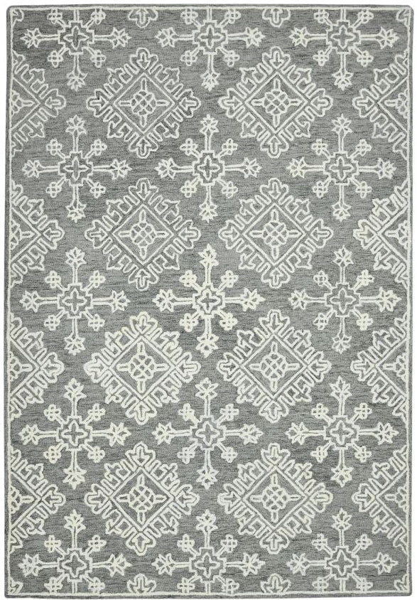 Gray area rug with white geometric pattern on a white background