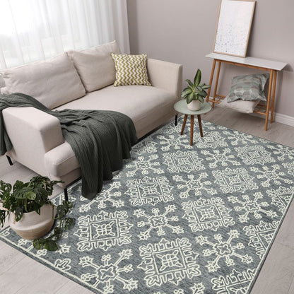 Living room with a patterned rug, sofa, and decorative items.