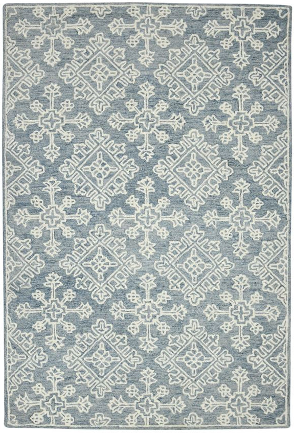 Patterned rug with blue and white design on a plain background