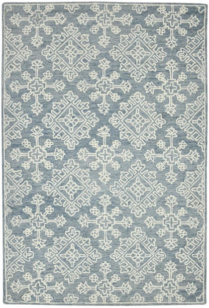 Patterned rug with blue and white design on a plain background