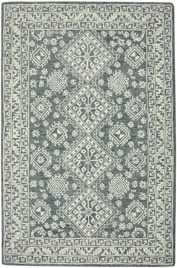 Gray and white patterned rug on a white background