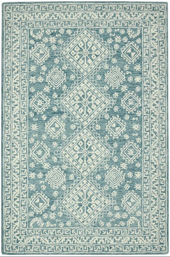 Blue and white patterned rug on a white background