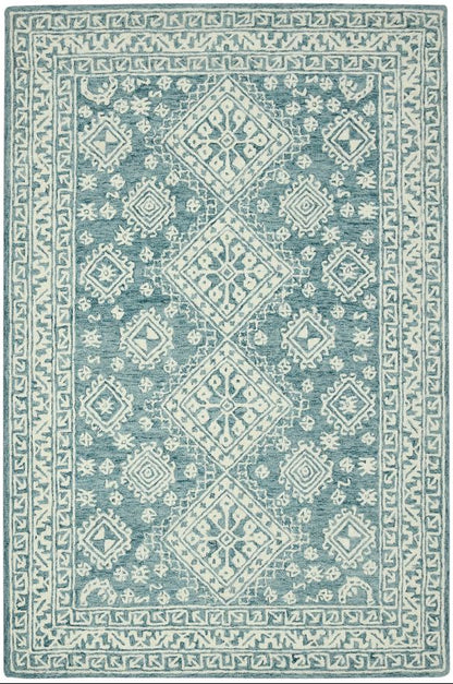 Blue and white patterned rug on a white background
