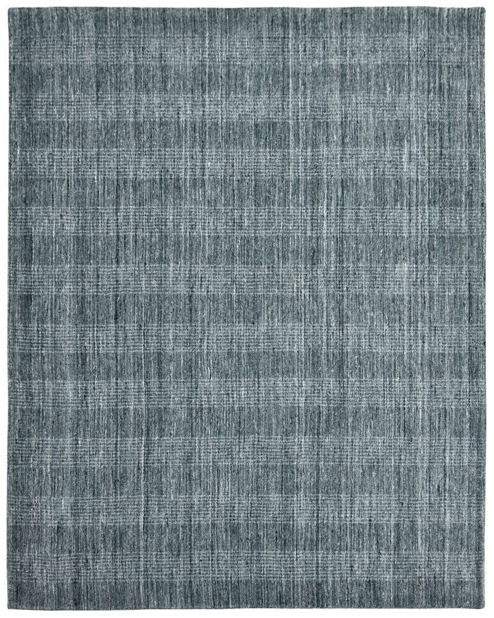 Textured blue rug on a white background
